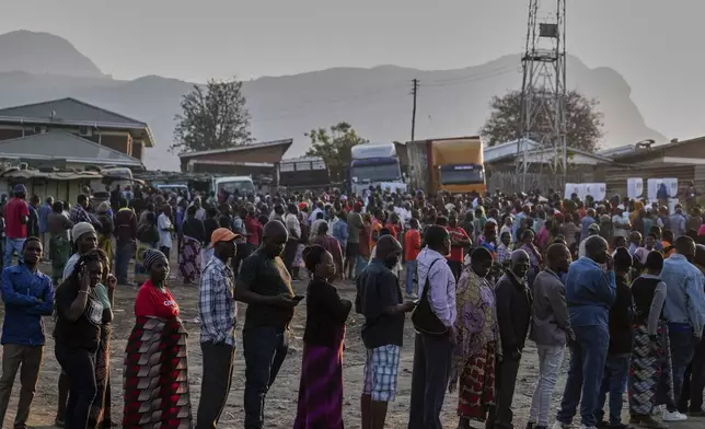 People line up to cast their votes in Blantyre, Malawi, Tuesday, Sept. 16, 2025. (AP Photo/Thoko Chikondi)