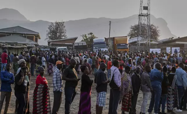 People line up to cast their votes in Blantyre, Malawi, Tuesday, Sept. 16, 2025. (AP Photo/Thoko Chikondi)