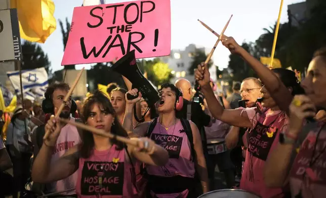 FILE - People take part in a protest demanding the immediate release of all hostages held by Hamas and calling for the end to the war in Gaza, in Jerusalem, Wednesday, Sept. 3, 2025. (AP Photo/Leo Correa, File)