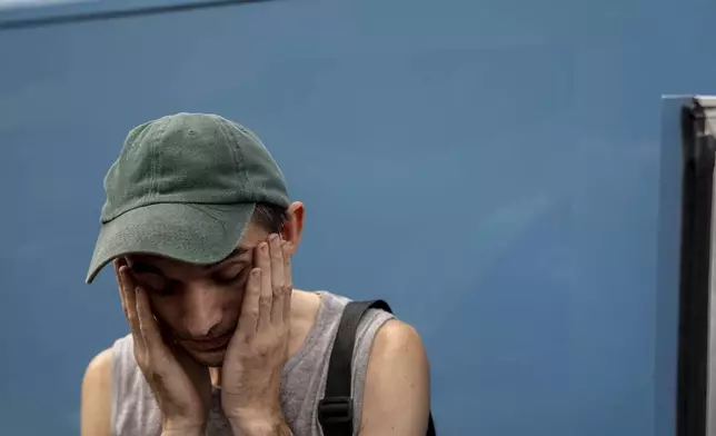 Dmytro Trush, who lost his mother, reacts, while he is being evacuated from the village of Yarova, that was hit by Russian aerial strike, which killed dozens of civilians, in Sloviansk, Donetsk region, Tuesday, Sept.9, 2025. (AP Photo/Alex Babenko)