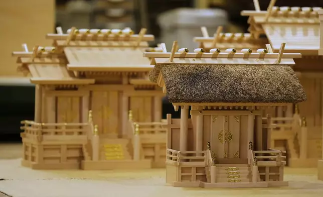Handmade Shinto shrine alters are seen at Miyachu factory, which crafts miniature replicas of the Ise Jingu shrine, in Tamaki, central Japan, Thursday, May 1, 2025. (AP Photo/Hiro Komae)