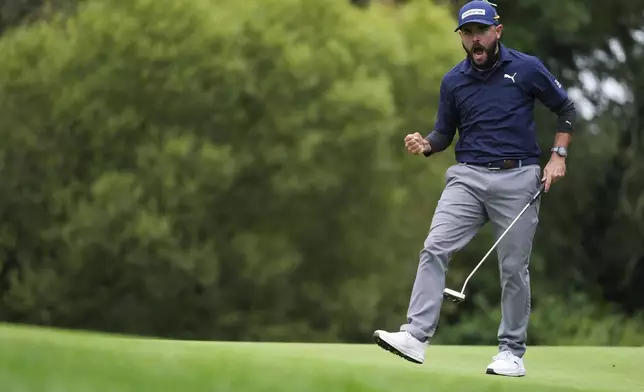 Angel Hidalgo reacts after making par on the 17th hole during the third round of the Irish Open golf tournament, Saturday, Sept. 6, 2025, at The K Club in Straffan, Ireland. (Brian Lawless/PA via AP)