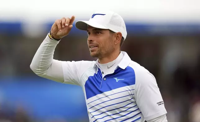 France's Adrien Saddier acknowledges the gallery during the third round of the Irish Open golf tournament, Saturday, Sept. 6, 2025, at The K Club in Straffan, Ireland. (Brian Lawless/PA via AP)