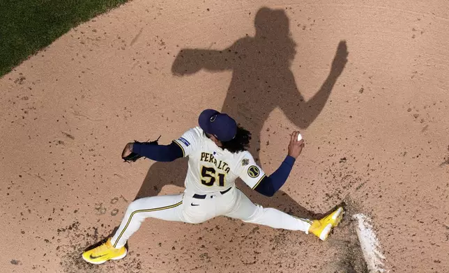 Milwaukee Brewers' Freddy Peralta throws during the fourth inning of a baseball game against the Philadelphia Phillies Thursday, Sept. 4, 2025, in Milwaukee. (AP Photo/Morry Gash)