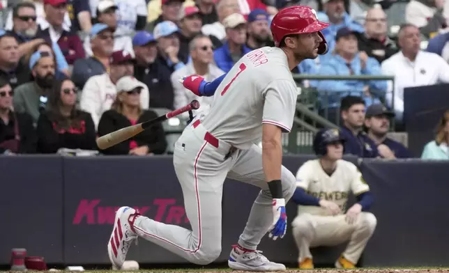 Philadelphia Phillies' Trea Turner hits an RBI single during the seventh inning of a baseball game against the Milwaukee Brewers Thursday, Sept. 4, 2025, in Milwaukee. (AP Photo/Morry Gash)