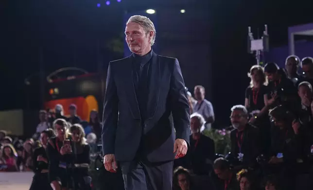 Mads Mikkelsen poses for photographers at the red carpet for the film 'The Last Viking' during the 82nd edition of the Venice Film Festival in Venice, Italy, on Saturday, Aug. 30, 2025. (Photo by Scott A Garfitt/Invision/AP)