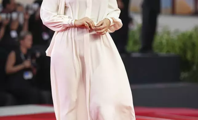 Alicia Silverstone poses for photographers on the red carpet for the film 'Bugonia' during the 82nd edition of the Venice Film Festival in Venice, Italy, on Thursday, Aug. 28, 2025. (Photo by Scott A Garfitt/Invision/AP)