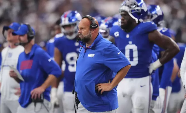 New York Giants head coach Brian Daboll watches play against the Dallas Cowboys in the second half of an NFL football game Sunday, Sept. 14, 2025, in Arlington, Texas. (AP Photo/Julio Cortez)