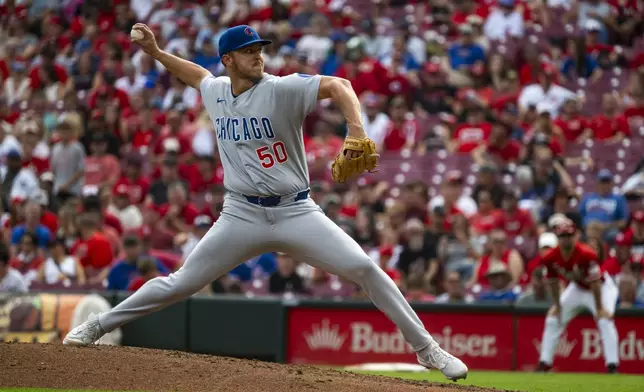 Chicago Cubs pitcher Jameson Taillon (50) delivers in the third inning of a baseball game against the Cincinnati Reds, Sunday, Sept. 21, 2025, in Cincinnati. (AP Photo/Michael Swensen)