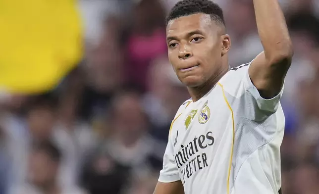 Real Madrid's Kylian Mbappe celebrates after scoring his side's second goal during a Champions League opening phase soccer match between Real Madrid and Marseille at Santiago Bernabeu stadium, in Madrid, Tuesday, Sept. 16, 2025. (AP Photo/Manu Fernandez)