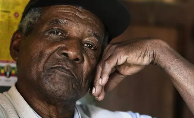 Julio Pinedo, a symbolic leader regarded as the king of the Afro-Bolivians, pauses during an interview at his home in Mururata, Bolivia, Sunday, Aug. 3, 2025. (AP Photo/Juan Karita)