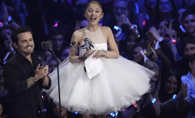 Christian Breslauer, left, and Ariana Grande accept the award for video of the year for "Brighter Days Ahead" during the MTV Video Music Awards on Sunday, Sept. 7, 2025, at UBS Arena in Elmont, N.Y. (Photo by Charles Sykes/Invision/AP)