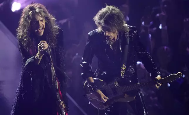 Steven Tyler, left, and Joe Perry perform a tribute to Ozzy Osbourne during the MTV Video Music Awards on Sunday, Sept. 7, 2025, at UBS Arena in Elmont, N.Y. (Photo by Charles Sykes/Invision/AP)