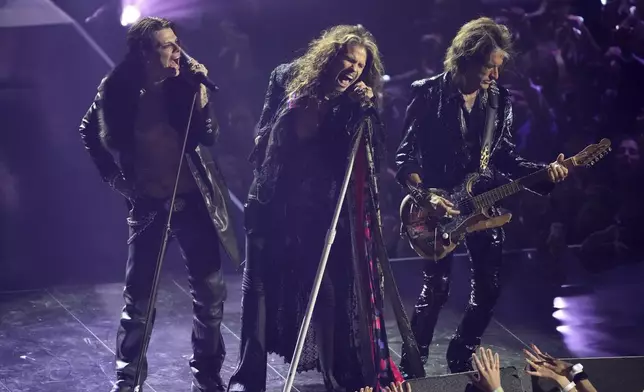 Yungblud, from left, Steven Tyler, and Joe Perry perform a tribute to Ozzy Osbourneduring the MTV Video Music Awards on Sunday, Sept. 7, 2025, at UBS Arena in Elmont, N.Y. (Photo by Charles Sykes/Invision/AP)