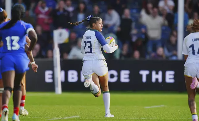 Brazil's Bianca Silva breaks away and scores a try during the Women's Rugby World Cup 2025 Pool D match between France and Brazil a at Sandy Park, Exeter, England, Sunday Aug. 31, 2025. (Ben Birchall/PA via AP)