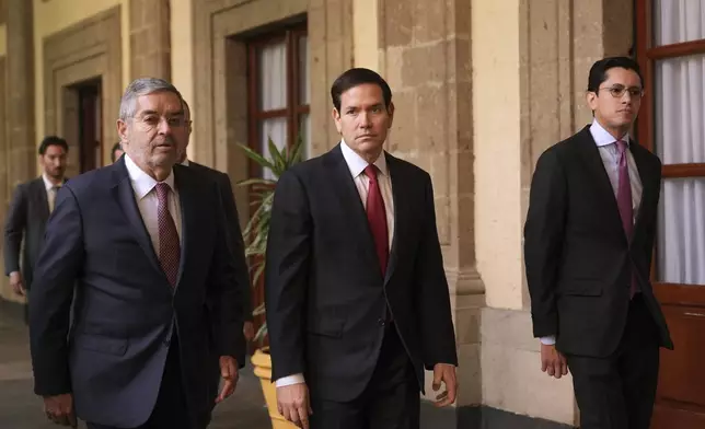 U.S. Secretary of State Marco Rubio, center, arrives to meet with Mexican President Claudia Sheinbaum at the National Palace in Mexico City, Wednesday, Sept. 3, 2025. (AP Photo/Jacquelyn Martin, pool)