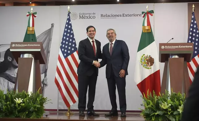 Secretary of State Marco Rubio, left, and Mexico's Foreign Secretary Juan Ramon de la Fuente shake hands following a news conference at the Foreign Ministry in Mexico City, Wednesday, Sept. 3, 2025. (AP Photo/Jacquelyn Martin, pool)