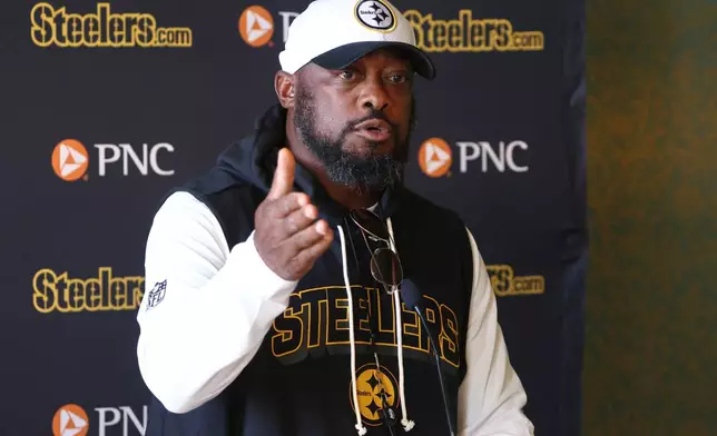 Pittsburgh Steelers head coach Mike Tomlin speaks at a press conference before a training session ahead of their match against Minnesota Vikings in Dublin, Friday, Sept. 26, 2025.(AP Photo/Peter Morrison)