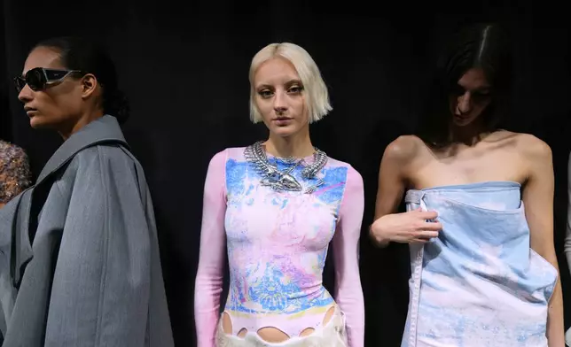 A model wears a creation part of the Diesel's Spring Summer 2026 collection in the backstage ahead of the collection's show, in Milan, Italy, Tuesday, Sept. 23, 2025. (AP Photo/Antonio Calanni)