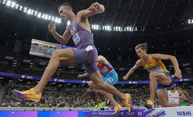 United States' Daniel Michalski, left, and Sweden's Vidar Johansson, right, compete in a men's 3,000 meters steeplechase heat at the World Athletics Championships in Tokyo, Saturday, Sept. 13, 2025. (AP Photo/Ashley Landis)