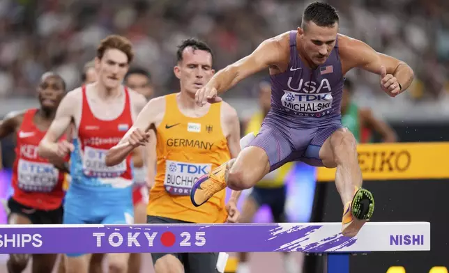 United States' Daniel Michalski, right, competes in the men's 3,000 meters steeplechase heat at the World Athletics Championships in Tokyo, Saturday, Sept. 13, 2025. (AP Photo/Eugene Hoshiko)