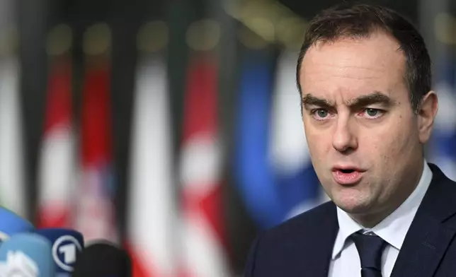 FILE - French Defense Minister Sebastien Lecornu speaks with the media as he arrives for a meeting of NATO defense ministers at NATO headquarters in Brussels, Feb. 13, 2025. (AP Photo/Harry Nakos, File)