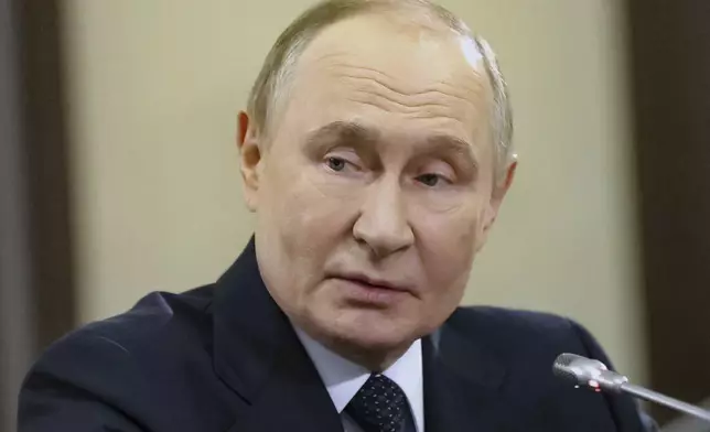 Russian President Vladimir Putin attends a meeting with leaders of the political parties represented in the State Duma, the Russian Lower House of the Parliament, at the Novo-Ogaryovo state residence, outside Moscow, Russia, on Thursday, Sept. 18, 2025. (Mikhail Sinitsyn, Sputnik, Kremlin Pool Photo via AP)