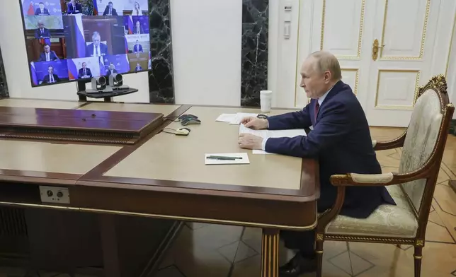 Russian President Vladimir Putin leads a cabinet meeting via videoconference at the Kremlin in Moscow, Russia, Wednesday, Sept. 17, 2025. (Vyacheslav Prokofyev, Sputnik, Kremlin Pool Photo via AP)