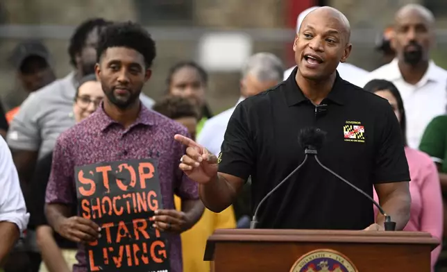 Maryland Gov. Wes Moore, right, speaks next to Baltimore mayor Brandon Scott, left, during a news conference, Friday, Sept. 5, 2025, in Baltimore. (AP Photo/Nick Wass)