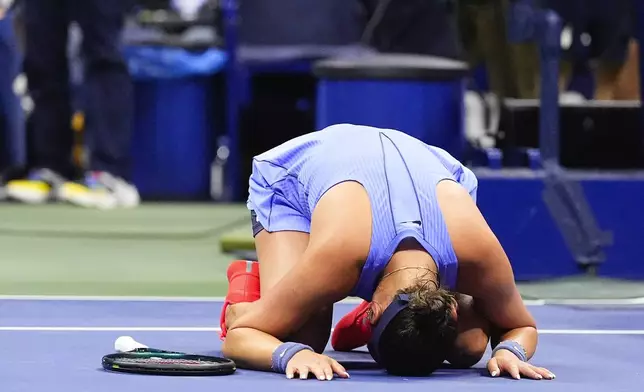 Amanda Anisimova, of the United States, reacts after defeating Naomi Osaka, of Japan, during the women's singles semifinals of the U.S. Open tennis championships, Friday, Sept. 5, 2025, in New York. (AP Photo/Yuki Iwamura)