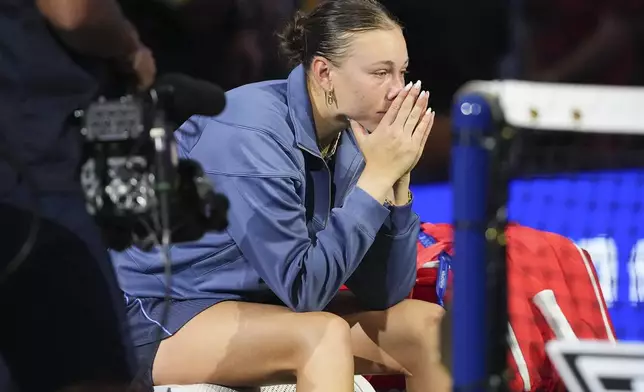Amanda Anisimova, of the United States, sits on her bench after losing to Aryna Sabalenka, of Belarus, in the women's singles final of the U.S. Open tennis championships, Saturday, Sept. 6, 2025, in New York. (AP Photo/Kirsty Wigglesworth)