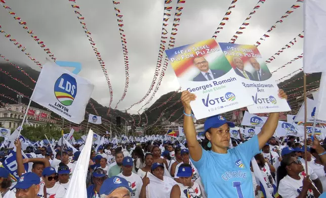 Supporters of Linyon Demokratik Seselwa's party attend a campaign rally at Freedom Square in Victoria, Seychelles, Sunday, Sep. 21, 2025. (AP Photo/Emilie Chetty)