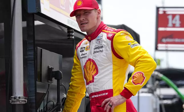 FILE - Josef Newgarden waits for the start of practice for the Indianapolis 500 auto race at the Indianapolis Motor Speedway in Indianapolis, Monday, May 19, 2025. (AP Photo/Michael Conroy, File)
