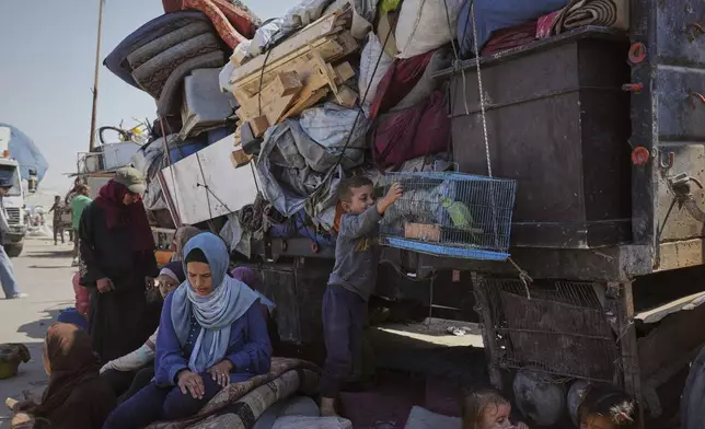 Displaced Palestinians flee northern Gaza along the coastal road toward the south, after Israel's military says its expanded operation in Gaza City has begun and warns residents to leave, Tuesday, Sept. 16, 2025. (AP Photo/Abdel Kareem Hana)