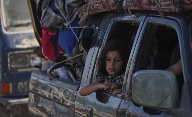 Displaced Palestinians flee northern Gaza along the coastal road toward the south, after Israel's military says its expanded operation in Gaza City has begun and warns residents to leave, Tuesday, Sept. 16, 2025. (AP Photo/Abdel Kareem Hana)