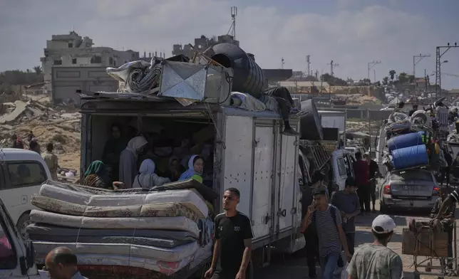 Displaced Palestinians flee northern Gaza along the coastal road toward the south, as Israel announced an expanded operation in Gaza City, Tuesday, Sept. 16, 2025. (AP Photo/Abdel Kareem Hana)