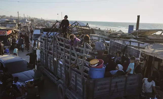 Displaced Palestinians fleeing Gaza City arrive in Muwasi, an area that Israel has designated as a safe zone, in Khan Younis southern Gaza Strip, Wednesday, Sept. 10, 2025. (AP Photo/Jehad Alshrafi)