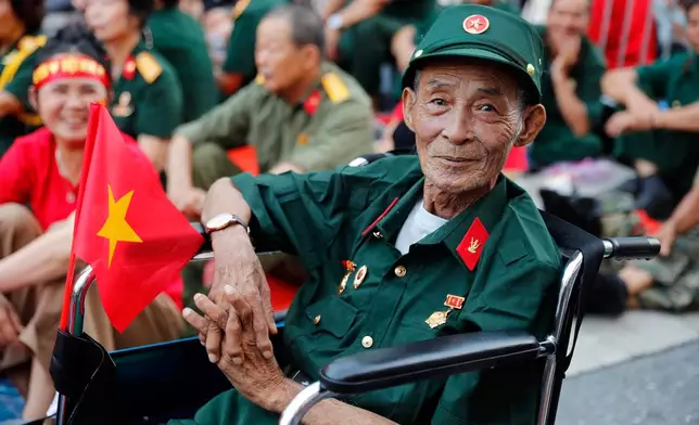 A Vietnamese veteran waits to watch a parade marking Vietnam's 80th National Day anniversary, at a street in Hanoi, Vietnam Tuesday, Sept. 2, 2025. (Luong Thai Linh/Pool Photo via AP)