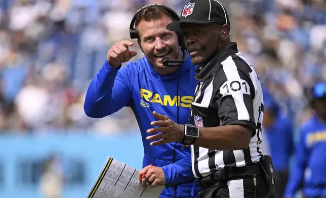 Los Angeles Rams head coach Sean McVay talks with an official during the second half of an NFL football game against the Tennessee Titans, Sunday, Sept. 14, 2025, in Nashville, Tenn. (AP Photo/John Amis)