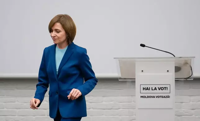 FILE - Moldova's President Maia Sandu leaves after speaking to the media during a press briefing after the polls closed for the presidential election runoff, in Chisinau, Moldova, Sunday, Nov. 3, 2024. (AP Photo/Vadim Ghirda, File)
