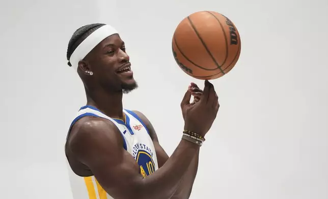 Golden State Warriors forward Jimmy Butler III poses for photos during the NBA basketball team's media day in San Francisco, Monday, Sept. 29, 2025. (AP Photo/Jeff Chiu)