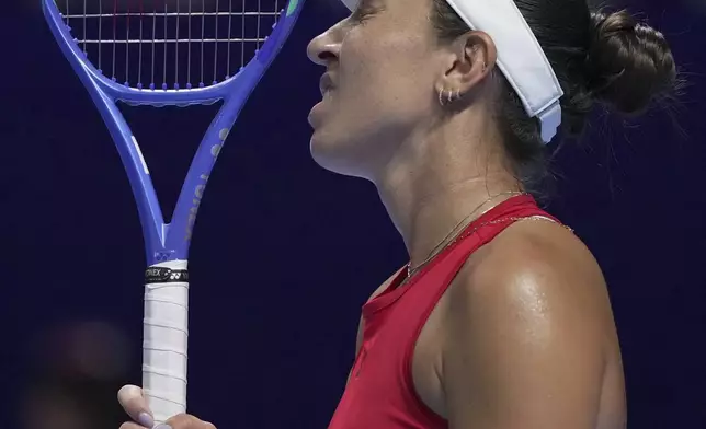 Jessica Pegula, of the United States reacts after losing a point to Jasmine Paolini, of Italy during the Billie Jean King Cup final tennis match, at the Shenzhen Bay Sports Center Arena, in Shenzhen, China's Guangdong province, Sunday, Sept. 21, 2025. (AP Photo/Andy Wong)