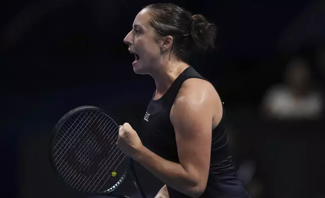 Elisabetta Cocciaretto, of Italy reacts after winning a break point against Emma Navarro, of the United States during the Billie Jean King Cup final tennis match, at the Shenzhen Bay Sports Center Arena, in Shenzhen, China's Guangdong province, Sunday, Sept. 21, 2025. (AP Photo/Andy Wong)