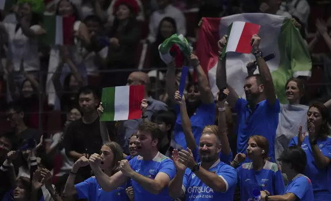 Italian supporters cheer after Jasmine Paolini, of Italy winning the first set against Jessica Pegula, of the United States during the Billie Jean King Cup final tennis match, at the Shenzhen Bay Sports Center Arena, in Shenzhen, China's Guangdong province, Sunday, Sept. 21, 2025. (AP Photo/Andy Wong)