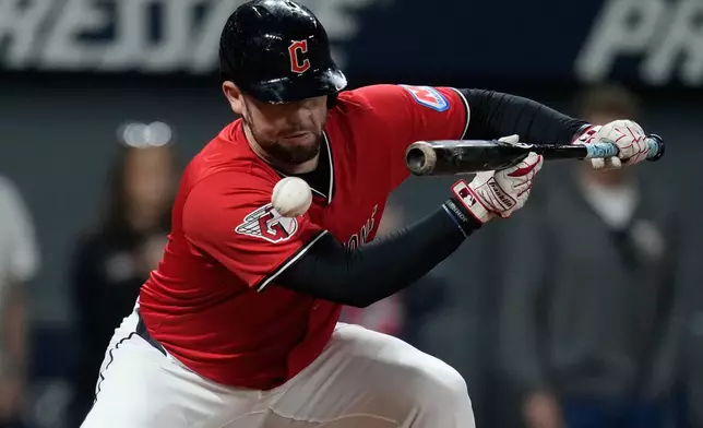 CORRECTION CORRECTS HITTING ON THE FACE BY PITCH - Cleveland Guardians' David Fry is hit in the face by a pitch in the sixth inning of a baseball game against the Detroit Tigers in Cleveland, Tuesday, Sept. 23, 2025. (AP Photo/Sue Ogrocki)