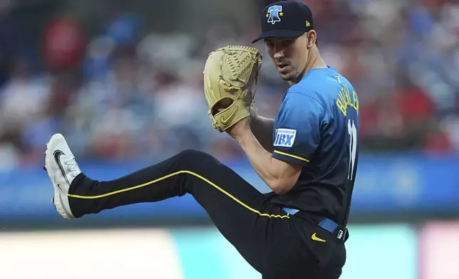 Philadelphia Phillies' Walker Buehler winds up to pitch during the first inning of a baseball game against the Kansas City Royals, Friday, Sept. 12, 2025, in Philadelphia. (AP Photo/Matt Rourke)