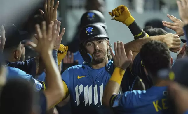 Philadelphia Phillies' Bryson Stott celebrates after hitting a two-run home run off of Kansas City Royals pitcher Taylor Clarke during the seventh inning of a baseball game, Friday, Sept. 12, 2025, in Philadelphia. (AP Photo/Matt Rourke)