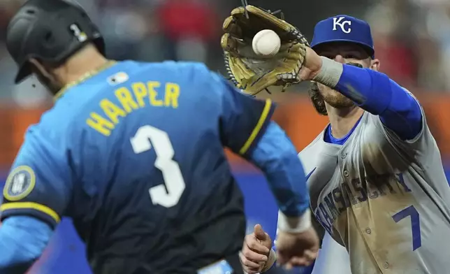 Philadelphia Phillies' Bryce Harper (3) is forced out by Kansas City Royals shortstop Bobby Witt Jr. during the fourth inning of a baseball game, Friday, Sept. 12, 2025, in Philadelphia. (AP Photo/Matt Rourke)