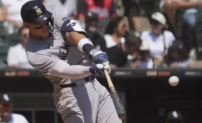 New York Yankees' Aaron Judge hits a solo home run during the first inning of a baseball game against the Chicago White Sox in Chicago, Sunday, Aug. 31, 2025. (AP Photo/Nam Y. Huh)