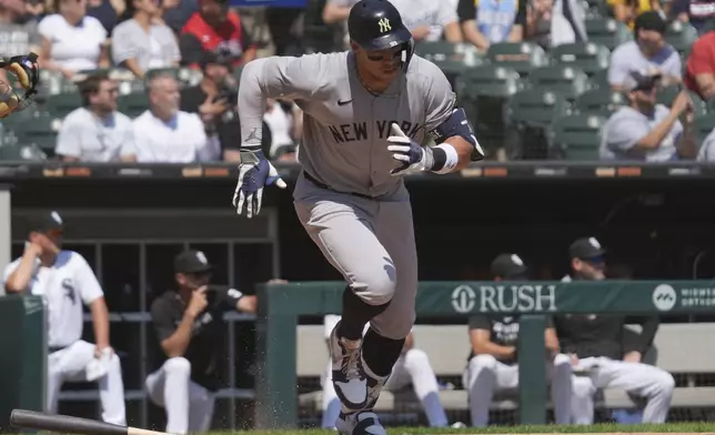 New York Yankees' Aaron Judge runs after hitting a solo home run during the first inning of a baseball game against the Chicago White Sox in Chicago, Sunday, Aug. 31, 2025. (AP Photo/Nam Y. Huh)